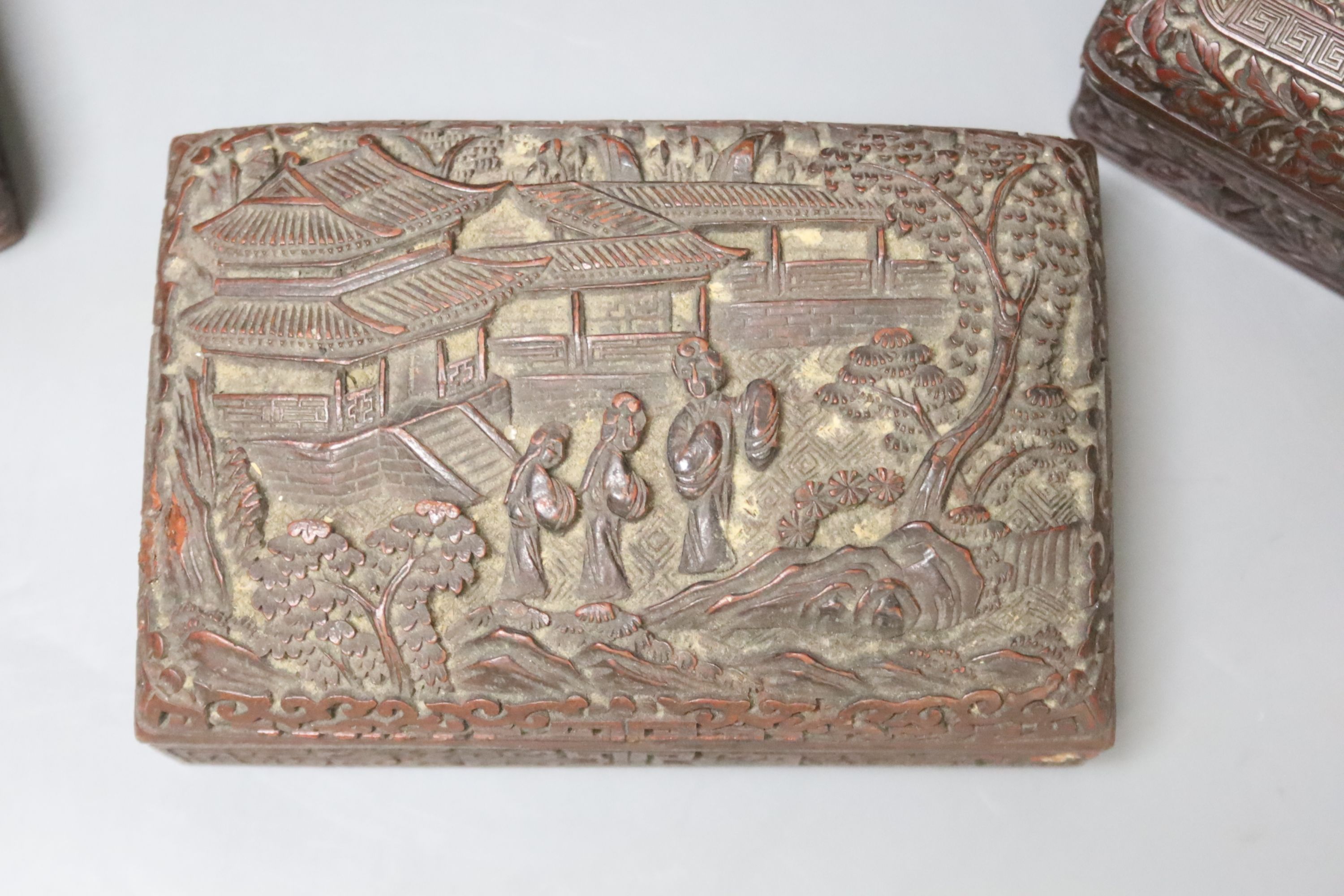 Four Chinese carved wood boxes, largest 24 x 12cm